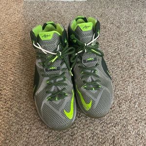 Gray and green Lebron sneakers